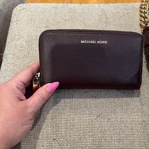 Wine colored NWOT Michael Kors zip around wristlet